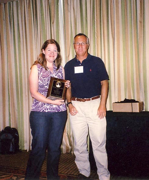 Jennifer Gillet receives Certificate of Appreciation for Special Service from Scott Ferguson