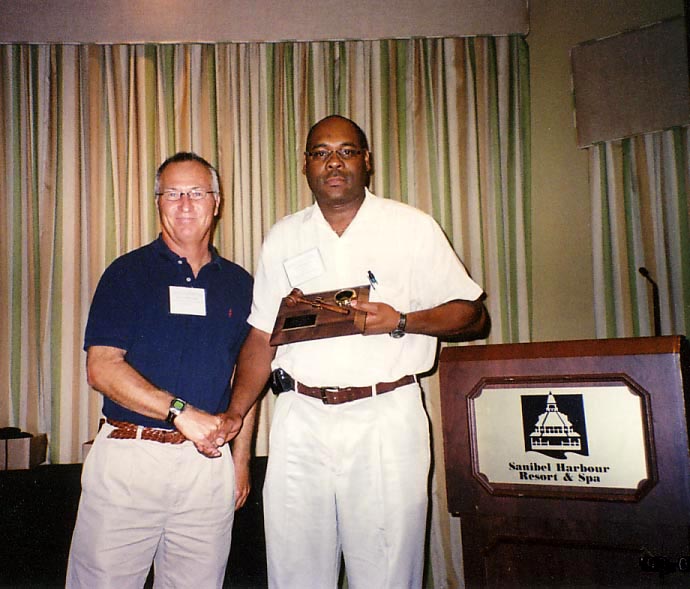 Scott Ferguson gives outgoing President Award to Oscar Liburd