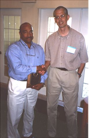 Jorge Pena receiving Annual Achievement Award for Research from Ken Bloem