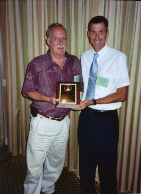 Michael Shannon Receiving Annual Achievement award for Regulatory Entomology from Rudi Scheffrahn.