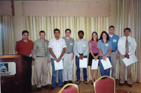 Student winners of FES 2005 $100 travel grants: (left to right) Ricky Vasquez, Charles Stuhl, Amit Senthi,  Joseph Smith, Murugesan Rangasamy,Crystal Kelts, Karla Addesso, and Frank Wessels with student Activities Committee Chair, Marco Toapanta