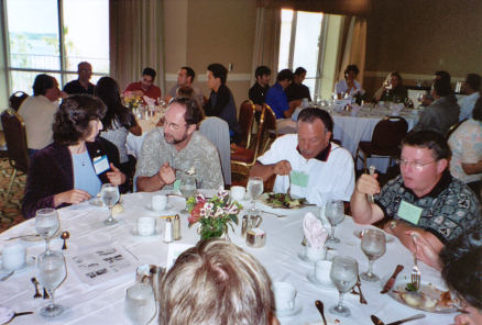 Julietta Brambilla, Russ Mizell, Phil Stansly, and Robert Meagher at table during awards luncheon
